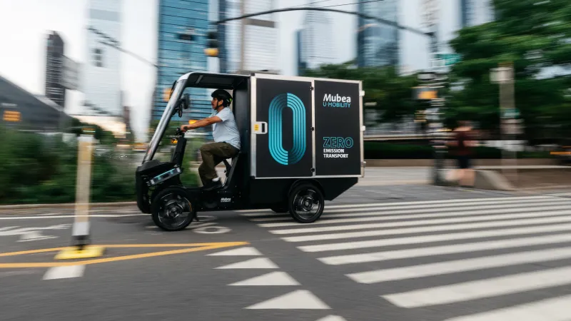 PACK driving in Manhattan in front of modern sky line